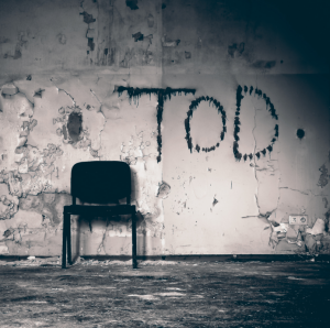 Horror, creepy room with chair and writing on wall