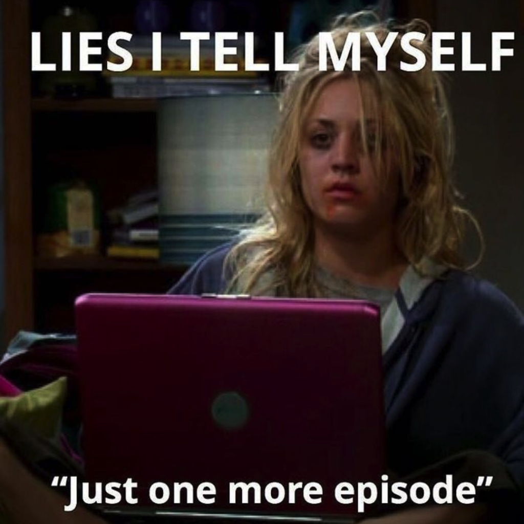 Big Bang Theory Penny binging series at her laptop