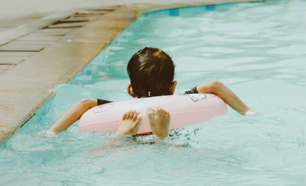 kid swimming, water wings, mastery